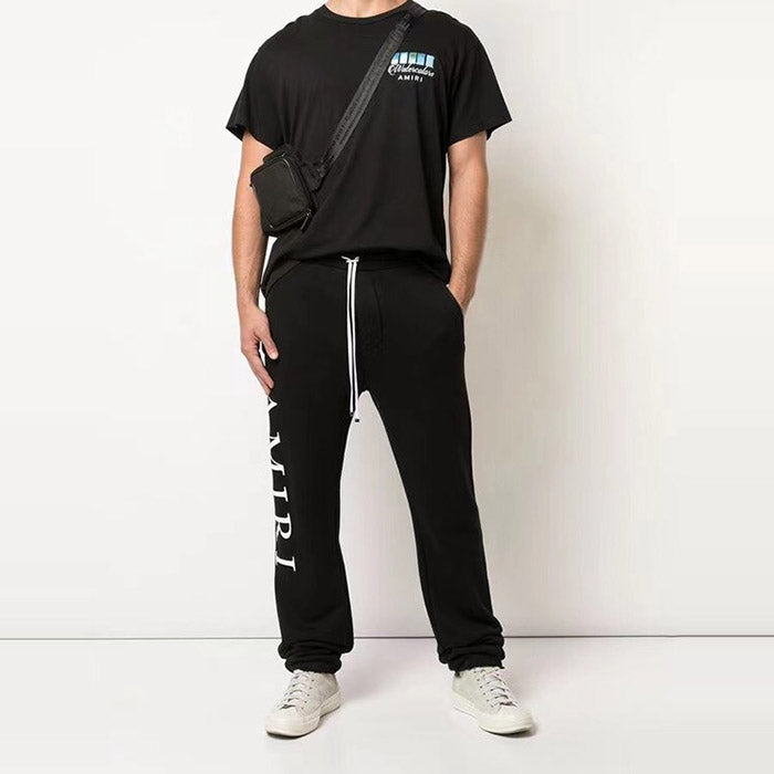 AMIRI Zoltar Tapered Logo-Print Cotton-Jersey Sweatpants